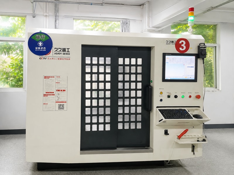 Enclosed CNC machining center with a control panel